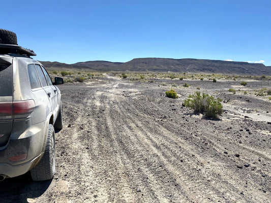 Rugged Jeep on a remote desert trail.